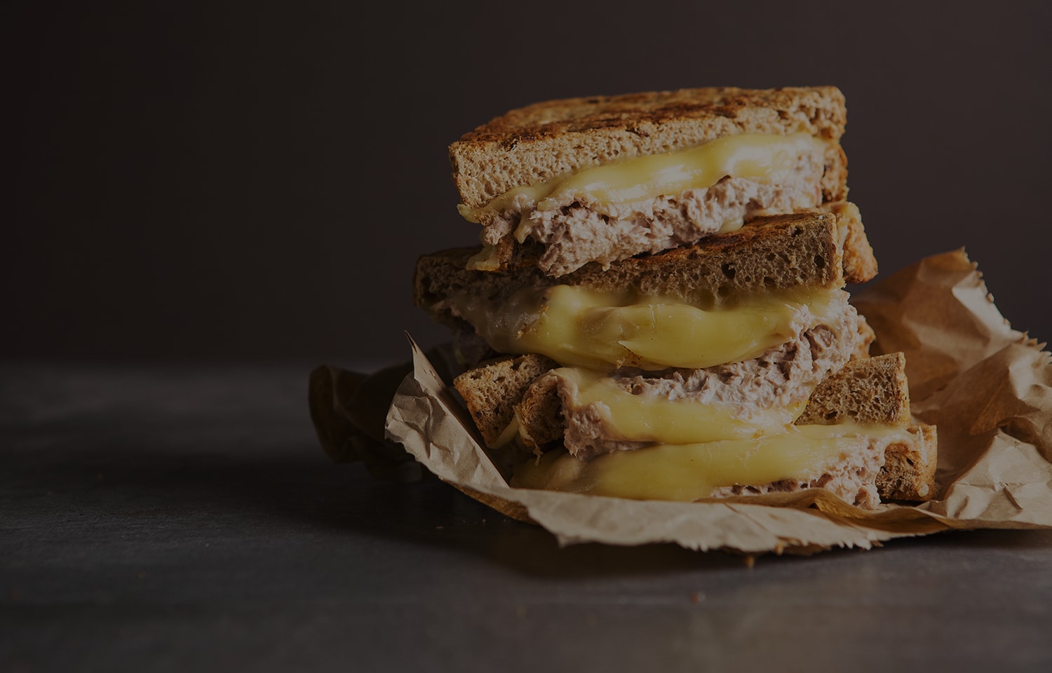 https://cdn-img.georgeforemangrills.com/manager/georgeforemangrills_com/Recipes/large_tuna_melt_recipie_banner_1500x960@1x.jpg